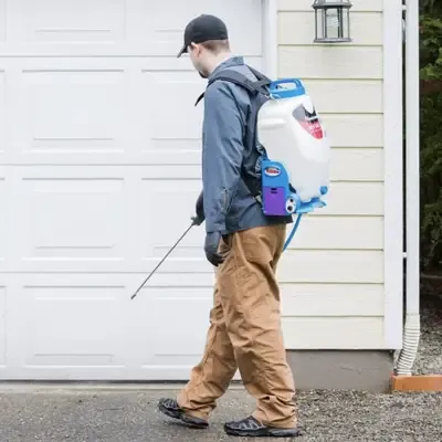 tech spraying garage